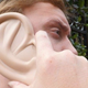 Illustration for article titled Why Is This Guy Holding His Giant Ear? Oh Because Its a Giant Ear iPhone Case
